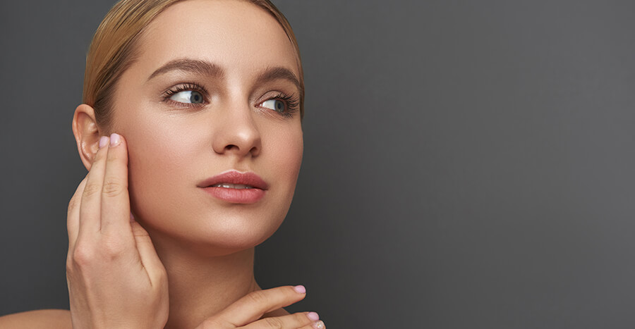 Woman touching face