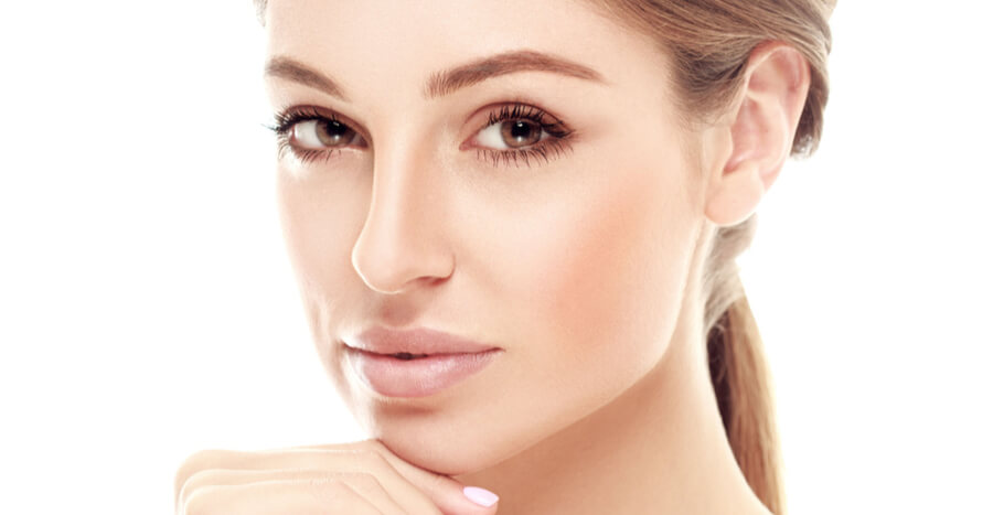 Young woman touching chin