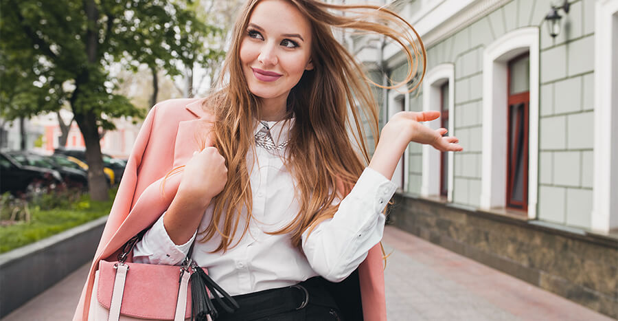 Woman flicking hair and smiling