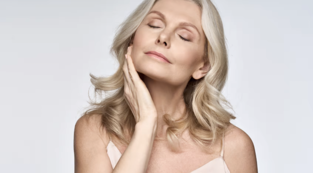 Mature woman touching face